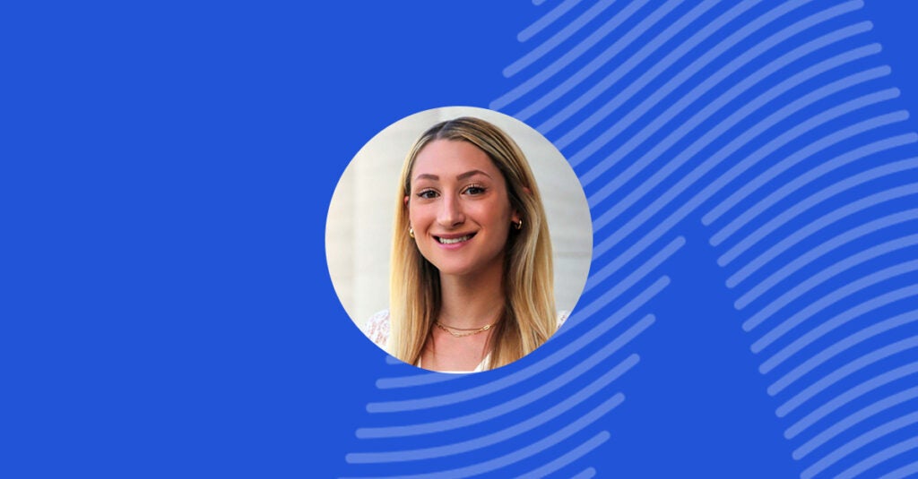 Image of Sydney W, former Adaptive intern, in front of a blue background